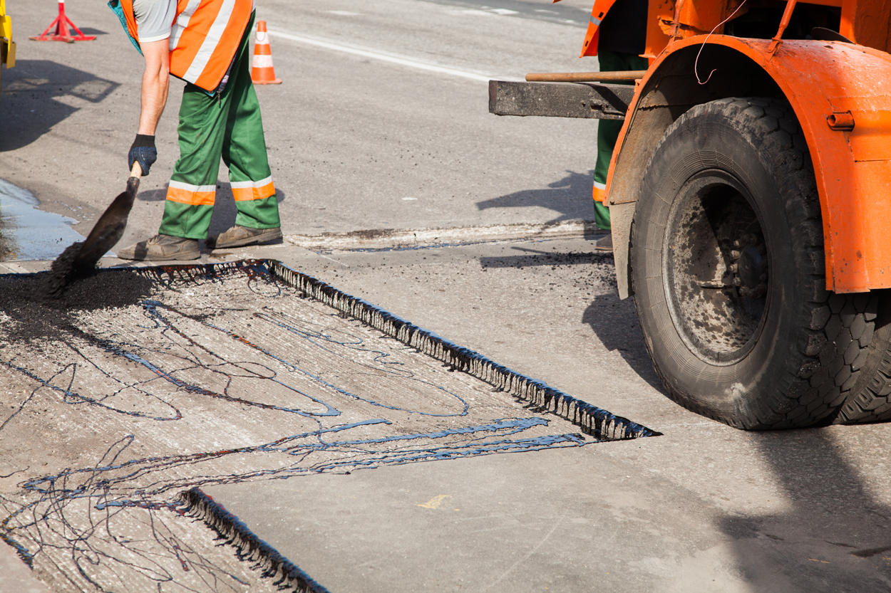 Road workers laying new asphalt on a Hertfordshire road