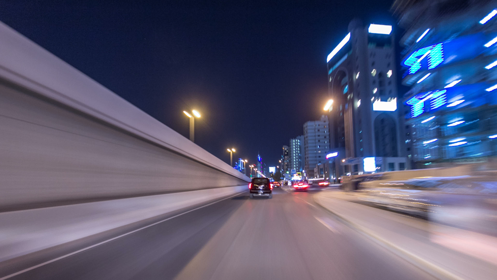A smooth, well-maintained road leading to a business entrance
