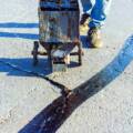 Crack Sealing vs. Overlaying: Which Is Right for Your Surface?