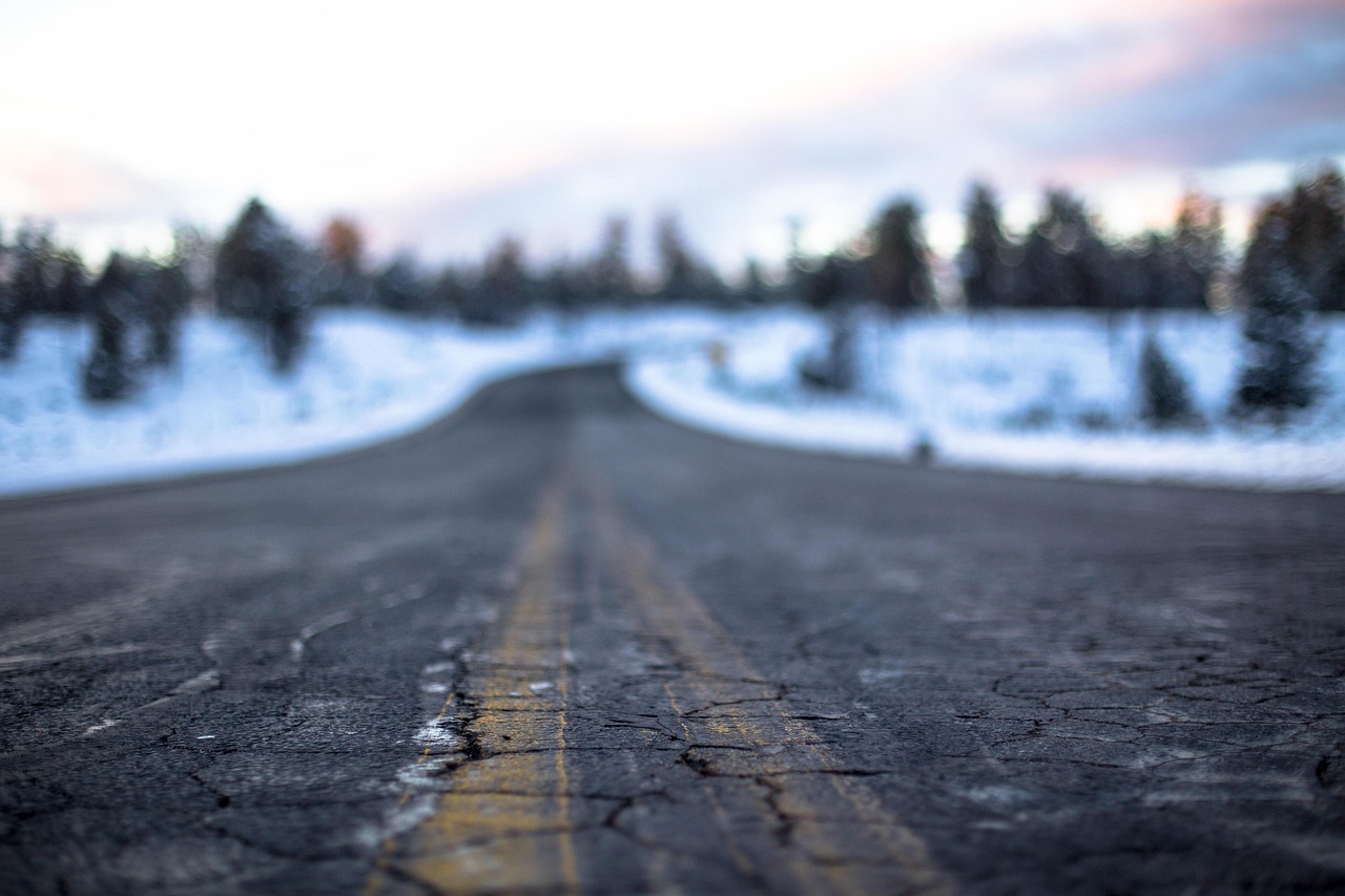 A pothole-ridden road after a harsh winter