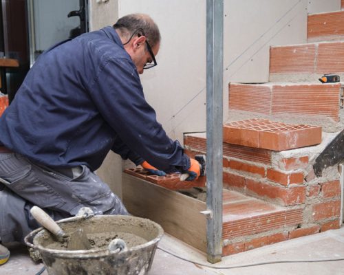 bricklayer-building-a-brick-staircase-in-a-home-in-2025-03-13-12-02-52-utc