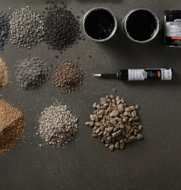 Dense Bituminous Macadam pothole repair on car park surface