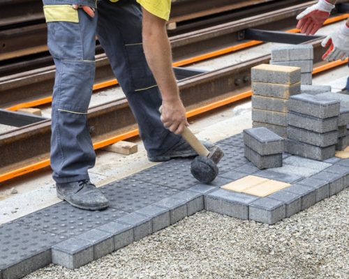 worker-hand-with-hammer-places-concrete-pavement-s-2025-10-16-21-42-28-utc
